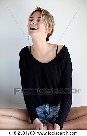 Stock Image - young woman wearing something black. Fotosearch