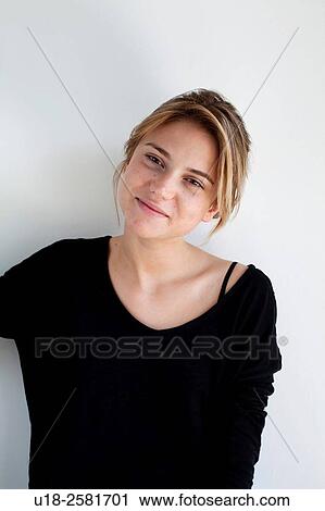 Stock Image - young woman wearing something black. Fotosearch