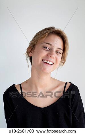 Stock Image - young woman wearing something black. Fotosearch