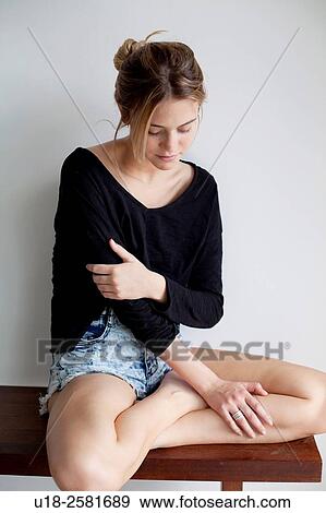 Stock Photo - young woman wearing something black. Fotosearch