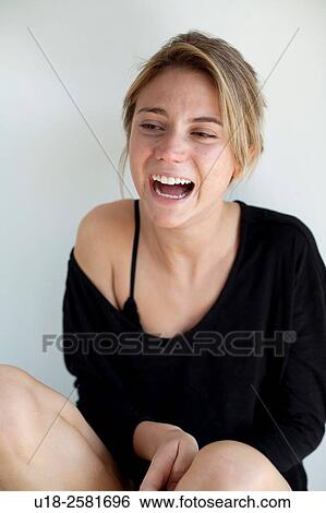 Stock Photograph - young woman wearing something black. Fotosearch