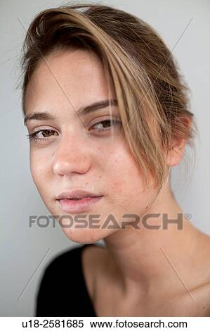 Stock Photography - young woman wearing something black. Fotosearch