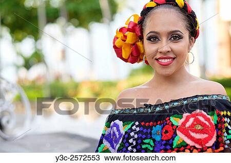 Young woman wearing traditional Mexican costume while smiling at camera. Puerto Vallarta, Jalisco, Mexico. View Large Photo Image Stock Image - Young woman wearing traditional Mexican costume while smiling at camera. Puerto Vallarta, Jalisco, Mexico.. Fotosearch