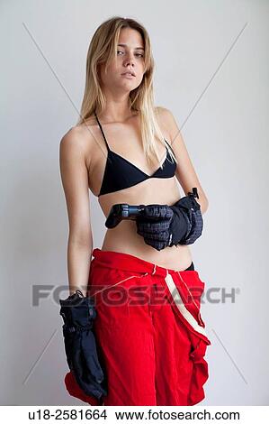 Young woman with gloves holding gamepad View Large Photo Image Picture - Young woman with gloves holding gamepad. Fotosearch