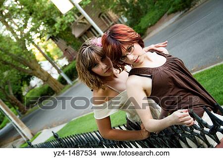 Picture - young women posing in the evening. Fotosearch
