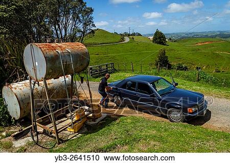 A Car Is Filled Up With Gas, Rural Farm, North Island, New Zealand. View Large Photo Image Stock Image - A Car Is Filled Up With Gas, Rural Farm, North Island, New Zealand.. Fotosearch