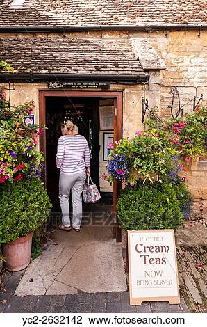 A woman entering the Plough Inn,. Ford,. Temple Guiting,. Cheltenham, England, Britain, Uk. View Large Photo Image Stock Image - A woman entering the Plough Inn,. Ford,. Temple Guiting,. Cheltenham, England, Britain, Uk.. Fotosearch