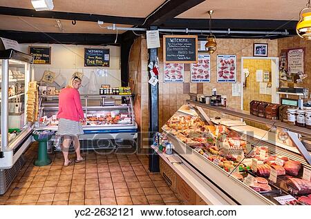 A woman in her 30s shopping in a butchers shop store in the Uk. View Large Photo Image Stock Image - A woman in her 30s shopping in a butchers shop store in the Uk.. Fotosearch