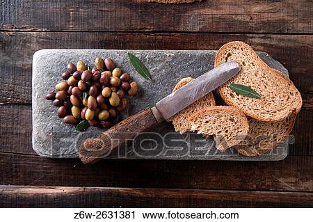 Aperitif made of bread with mixed olives in brine of Tuscany Italy. View Large Photo Image Stock Image - Aperitif made of bread with mixed olives in brine of Tuscany Italy.. Fotosearch