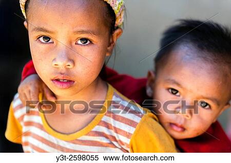 Asia. South-East Asia. Laos. Province of Vang Vieng. Rural village. Portrait of children. Sister and brother. View Large Photo Image Stock Photography - Asia. South-East Asia. Laos. Province of Vang Vieng. Rural village. Portrait of children. Sister and brother.. Fotosearch