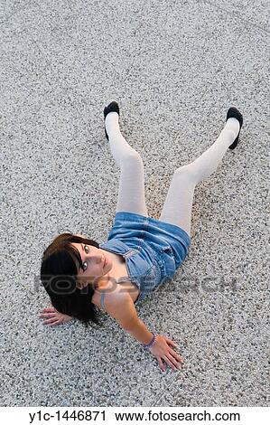 Attractive young woman is spread on the floor, denim short dress and fashionable White thighs View Large Photo Image Stock Image - Attractive young woman is spread on the floor, denim short dress and fashionable White thighs. Fotosearch