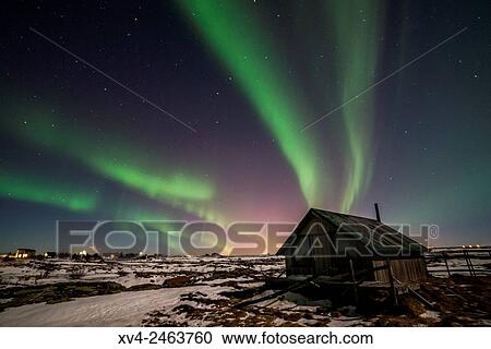 Aurora borealis above wooden house by Night, Iceland. View Large Photo Image Stock Image - Aurora borealis above wooden house by Night, Iceland.. Fotosearch