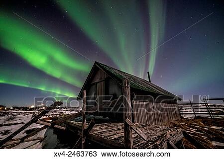 Aurora borealis above wooden house by Night, Iceland. View Large Photo Image Stock Image - Aurora borealis above wooden house by Night, Iceland.. Fotosearch