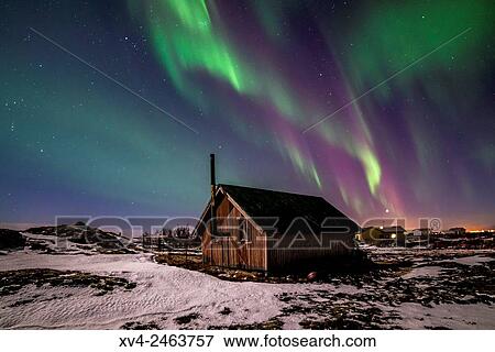 Aurora borealis above wooden house by Night, Iceland. View Large Photo Image Stock Photo - Aurora borealis above wooden house by Night, Iceland.. Fotosearch