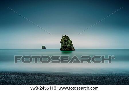 Basalt sea stacks in the ocean, Dyrholaey, Iceland. View Large Photo Image Stock Image - Basalt sea stacks in the ocean, Dyrholaey, Iceland.. Fotosearch