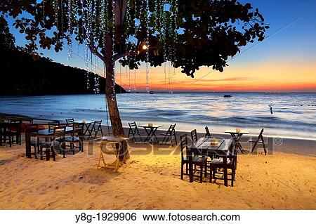 Beach Restaurant on the beach in Lima Coco Resort, sunset on the Ko Samet Island, Thailand View Large Photo Image Stock Photograph - Beach Restaurant on the beach in Lima Coco Resort, sunset on the Ko Samet Island, Thailand. Fotosearch