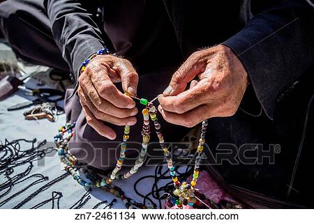 Bijouterie and tasbih seller at Pul-e Khishti Mosque, Kabul, Afghanistan. View Large Photo Image Picture - Bijouterie and tasbih seller at Pul-e Khishti Mosque, Kabul, Afghanistan.. Fotosearch