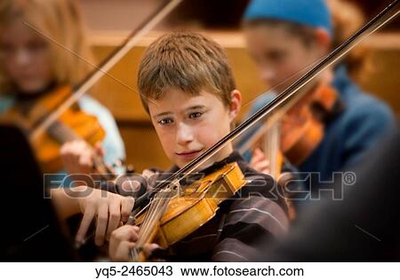 boy playing viola in orchestra. View Large Photo Image Stock Image - boy playing viola in orchestra.. Fotosearch