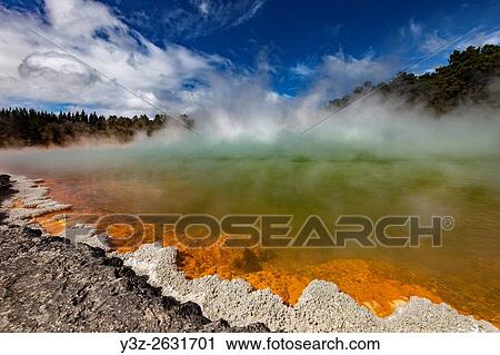 Champagne pool, burst of sunshine lights up foreshore during day of blowing mist and heavy rain, Wai-o-Tapu thermal region, Rotorua. View Large Photo Image Stock Image - Champagne pool, burst of sunshine lights up foreshore during day of blowing mist and heavy rain, Wai-o-Tapu thermal region, Rotorua.. Fotosearch