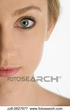 Close up of a beautiful young woman staring. View Large Photo Image Stock Photo - Close up of a beautiful young woman staring.. Fotosearch