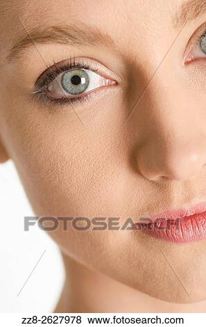 Close up of a beautiful young woman staring. View Large Photo Image Stock Photo - Close up of a beautiful young woman staring.. Fotosearch
