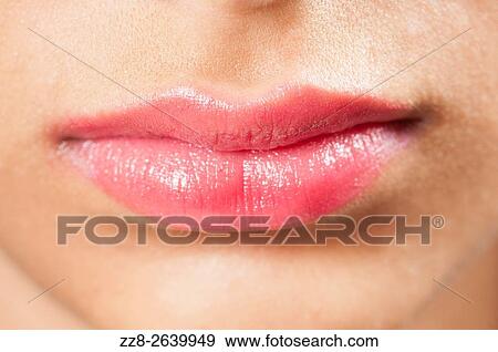 Stock Photo - Close up of a young womans lips.. Fotosearch