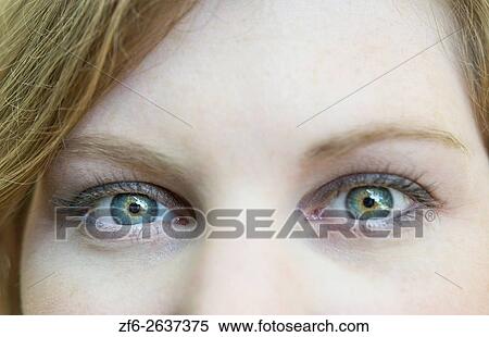 close-up of young womans eye and face blinking abstract MR model released. View Large Photo Image Stock Photography - close-up of young womans eye and face blinking abstract MR model released.. Fotosearch
