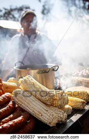 Colombian traditional food roasted over charcoal. woman cooking. View Large Photo Image Stock Photo - Colombian traditional food roasted over charcoal. woman cooking.. Fotosearch