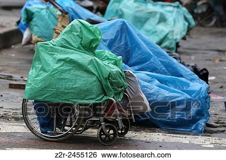 Dhaka 11 June 11, 2015. A beggar taking shelter from the rain in front of Dhaka High Court. Photo by Palash Khan. View Large Photo Image Stock Photograph - Dhaka 11 June 11, 2015. A beggar taking shelter from the rain in front of Dhaka High Court. Photo by Palash Khan.. Fotosearch