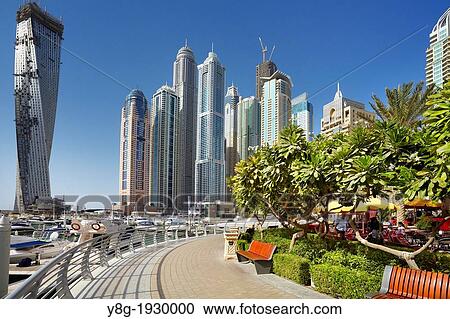 Dubai Marina - promenade in Marina district, Dubai, United Arab Emirates View Large Photo Image Stock Image - Dubai Marina - promenade in Marina district, Dubai, United Arab Emirates. Fotosearch