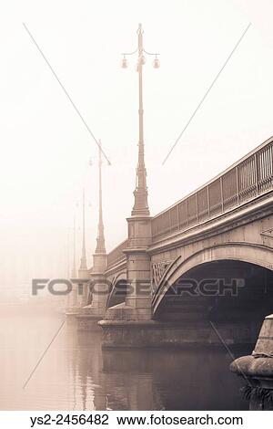 Empty bridge in heavy fog. Tranquil city scene with old architecture in Stockholm, Sweden. View Large Photo Image Stock Image - Empty bridge in heavy fog. Tranquil city scene with old architecture in Stockholm, Sweden.. Fotosearch