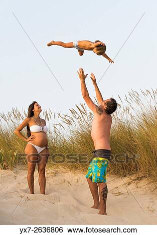 Stock Photograph - Family enjoying the beach. Tarifa, Costa de la Luz, Cadiz, Andalusia, Spain, Southern Europe.. Fotosearch