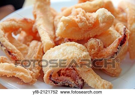 Fried squids on plate View Large Photo Image Stock Image - Fried squids on plate. Fotosearch