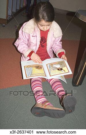 Girl age 5 involved in reading book. James J. Hill Reference Library St Paul Minnesota USA. View Large Photo Image Stock Image - Girl age 5 involved in reading book. James J. Hill Reference Library St Paul Minnesota USA.. Fotosearch