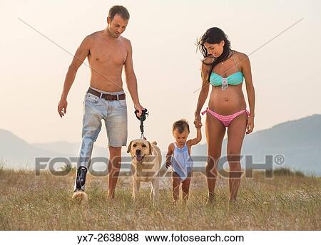 Stock Photo - Handicapped father and family.. Fotosearch