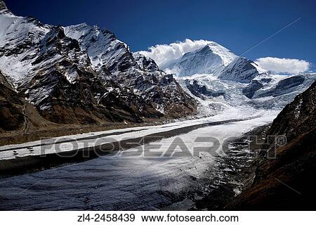 Stock Photo - India, Jammu and Kashmir State, Himalaya, Ladakh, Zanskar, Suru valley, Parkachik glacier and mount Nun (7135m).. Fotosearch