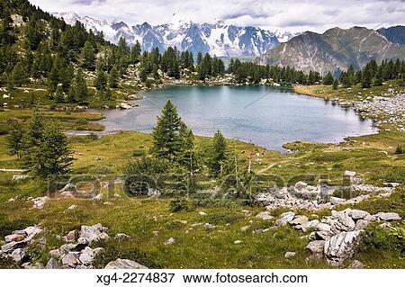 Italia, Val dAosta, Alpes, Arpy LakeMont Blanc massif in background View Large Photo Image Stock Photo - Italia, Val dAosta, Alpes, Arpy LakeMont Blanc massif in background. Fotosearch