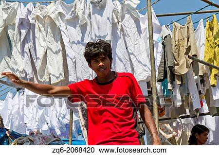 Stock Image - Launderer in Dhobi Ghat in Mumbai, India.. Fotosearch