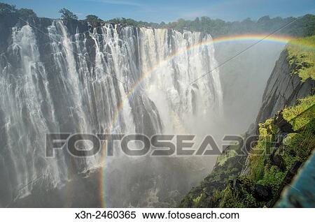 LIVINGSTONE, ZAMBIA - Victoria Falls Waterfall with rainbow. View Large Photo Image Stock Photography - LIVINGSTONE, ZAMBIA - Victoria Falls Waterfall with rainbow.. Fotosearch