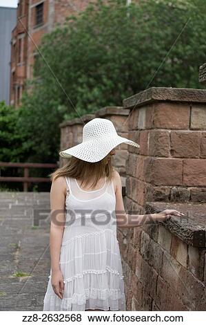 Lonely woman in a white dress standing outdoors. View Large Photo Image Stock Photo - Lonely woman in a white dress standing outdoors.. Fotosearch