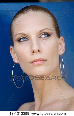 Stock Photo - Looking cold pretty young woman portrait. Fotosearch