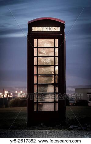 Man making call from red telephone box at night. England, United Kingdom. View Large Photo Image Stock Image - Man making call from red telephone box at night. England, United Kingdom.. Fotosearch