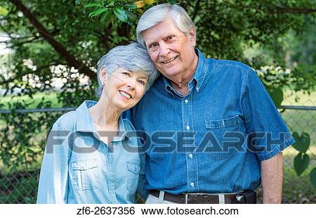 Stock Photograph - Mature retired couple married 49 years portrait in the park together in love MR Model released MR-1 MR- 2.. Fotosearch