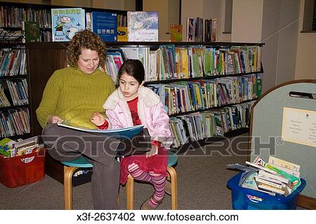 Mom and daughter ages 42 and 6 reading book together. James J. Hill Reference Library St Paul Minnesota USA. View Large Photo Image Stock Image - Mom and daughter ages 42 and 6 reading book together. James J. Hill Reference Library St Paul Minnesota USA.. Fotosearch