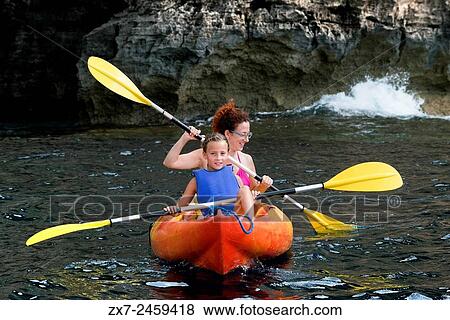 Mother and daughter doing kayaking on Cala Sahona, Formentera, Balearics Islands, Spain. Barbaria Cape. View Large Photo Image Stock Photo - Mother and daughter doing kayaking on Cala Sahona, Formentera, Balearics Islands, Spain. Barbaria Cape.. Fotosearch