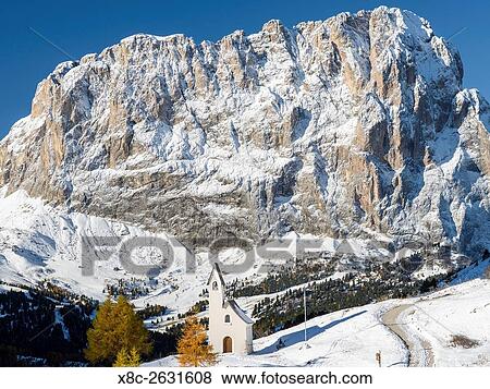 Mount Langkofel - Sassolungo and the chapel at Groedner Joch - Passo Gardena in the Dolomites of South Tyrol - Alto Adige. The Dolomites are listed as UNESCO World heritage. europe, central europe, italy, october. View Large Photo Image Stock Photo - Mount Langkofel - Sassolungo and the chapel at Groedner Joch - Passo Gardena in the Dolomites of South Tyrol - Alto Adige. The Dolomites are listed as UNESCO World heritage. europe, central europe, italy, october.. Fotosearch