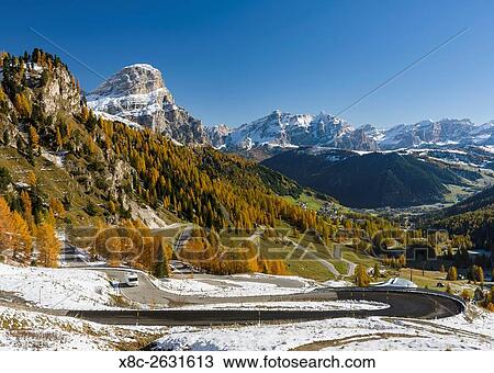 Mountain road leading up to Groedner Joch - Passo Gardena from the Gader valley - Val Badia in the Dolomites of South Tyrol - Alto Adige. View towards Corvara, Alta Badia and mount Heiligkreuzkofel - Sasso di Santa Croce in the fanes mountain range.... View Large Photo Image Stock Image - Mountain road leading up to Groedner Joch - Passo Gardena from the Gader valley - Val Badia in the Dolomites of South Tyrol - Alto Adige. View towards Corvara, Alta Badia and mount Heiligkreuzkofel - Sasso di Santa Croce in the fanes mountain range..... Fotosearch
