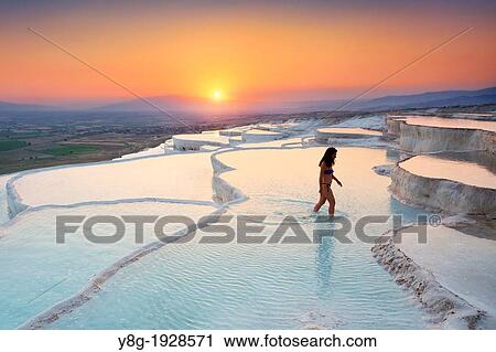 Pamukkale, woman walking on limestone terraces, Pamukkale near Denizli, Turkey View Large Photo Image Stock Image - Pamukkale, woman walking on limestone terraces, Pamukkale near Denizli, Turkey. Fotosearch