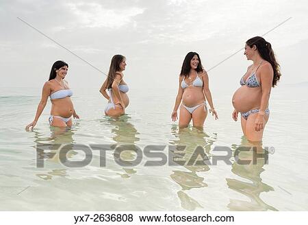 Pregnant women at the beach. Tarifa, Costa de la Luz, Cadiz, Andalusia, Southern Spain, Europe. View Large Photo Image Stock Photo - Pregnant women at the beach. Tarifa, Costa de la Luz, Cadiz, Andalusia, Southern Spain, Europe.. Fotosearch