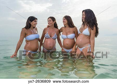 Pregnant women at the beach. Tarifa, Costa de la Luz, Cadiz, Andalusia, Southern Spain, Europe. View Large Photo Image Stock Photo - Pregnant women at the beach. Tarifa, Costa de la Luz, Cadiz, Andalusia, Southern Spain, Europe.. Fotosearch